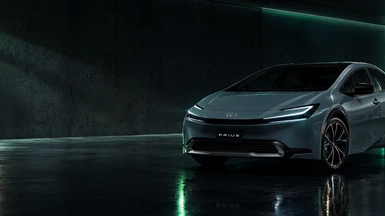 Toyota Prius in a dark studio, lit in green, at the start of a 360° camera turn